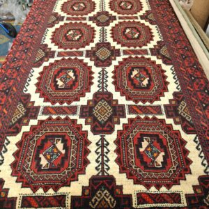 Käsinsolmittu iranilainen villamatto, Balutch