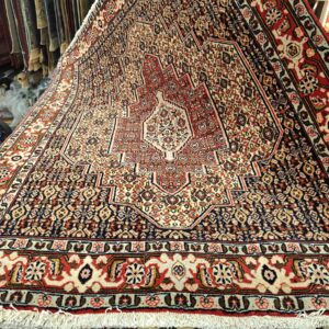 Käsinsolmittu villamatto, Seneh